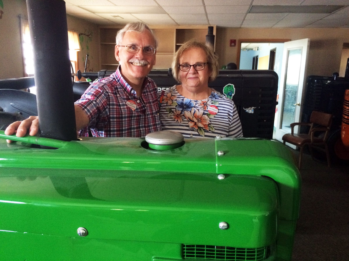 030 Dave Mettenbrink and Deb Figgner at the Galen Furstenau John Deere Museum in Neligh.JPG